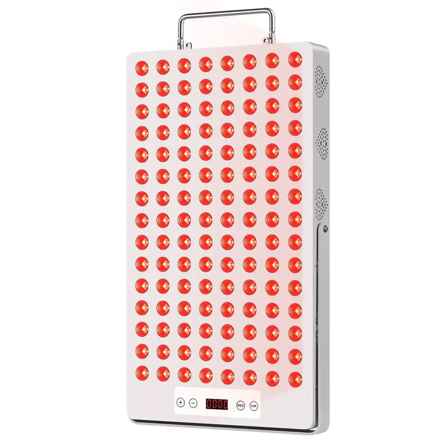 White rectangular led therapy panel with a grid of red circular lights, silver handle and side vents.