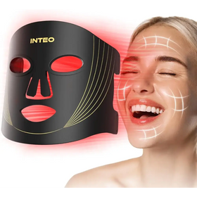 Black inteo led facial mask with red light therapy panels and gold accent lines.