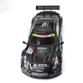 Black carbon fiber finish rc race car with sponsor decals and a rear spoiler.