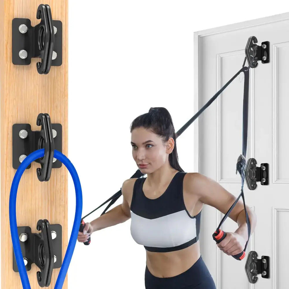 Black door-mounted resistance band system with adjustable hooks and a blue elastic loop