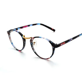 Round-framed glasses with a black base and vibrant floral pattern in blue, pink, and red hues, accented by gold-colored metal details.