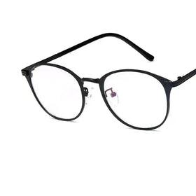 Black round-framed reading glasses with clear lenses and a sleek, minimalist design.