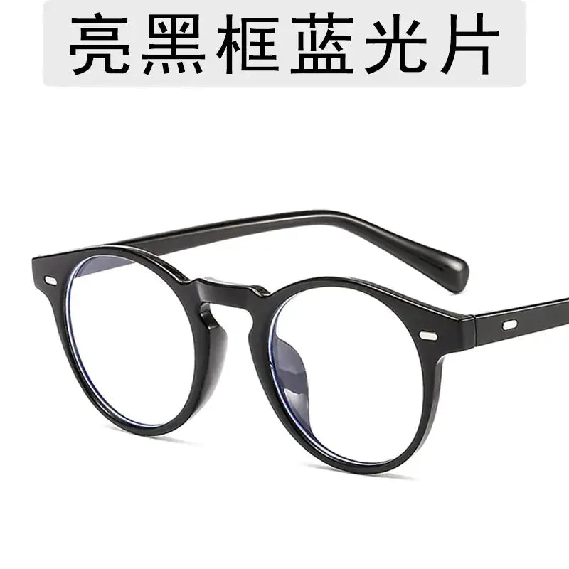 Black round-framed glasses with blue-tinted lenses.