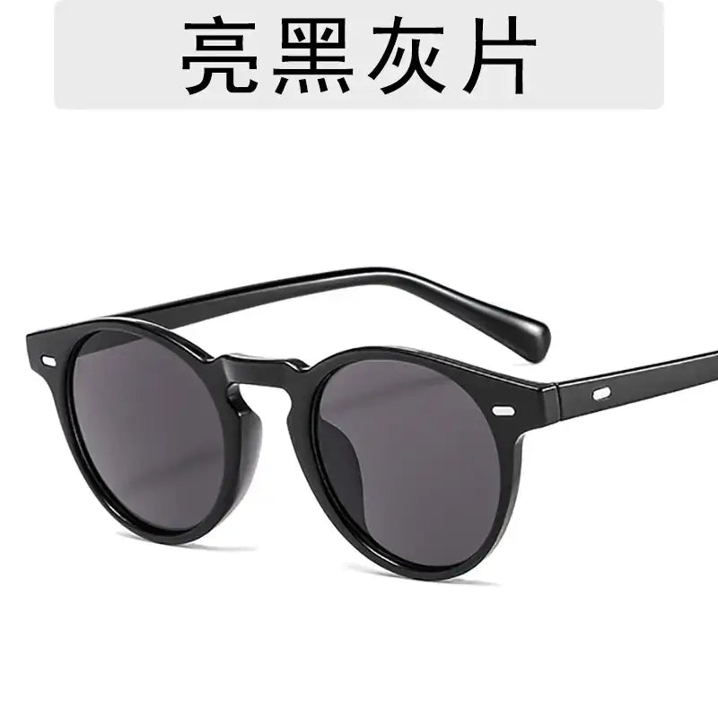 Black round-frame sunglasses with dark gray lenses.