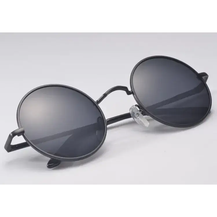 Black round-framed sunglasses with dark gray mirrored lenses and clear plastic nose pads.