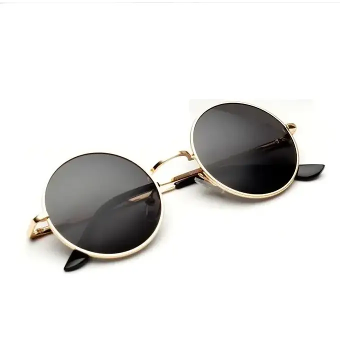 Gold-rimmed round sunglasses with dark gray lenses and black temple tips.