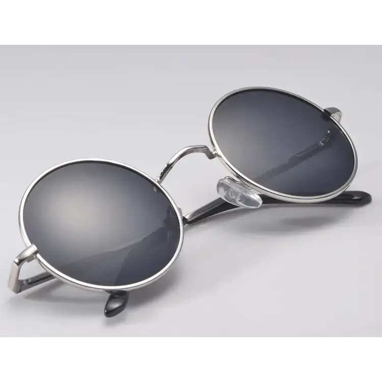 Round silver-framed sunglasses with dark mirrored lenses and black temple tips.
