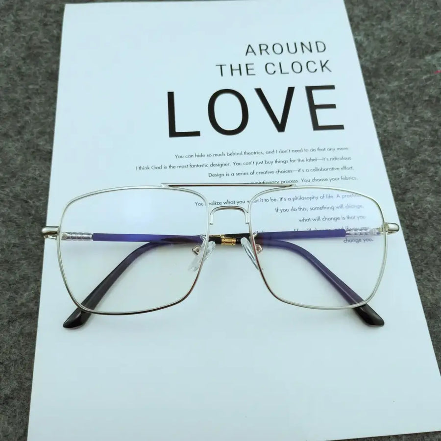 Silver-framed rectangular glasses with purple and black temple arms, featuring a gold-colored hinge.