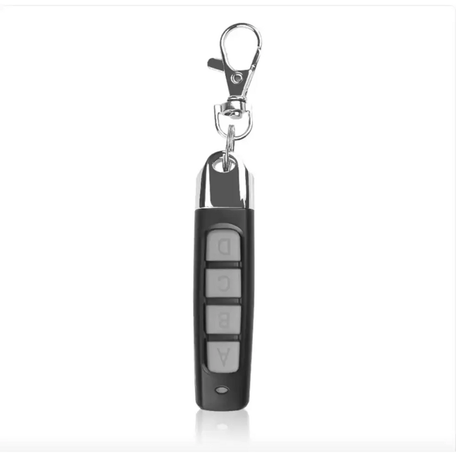 Black remote control with silver buttons labeled a through d and a chrome keychain attachment.