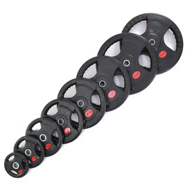 Black rubber-coated weight plates with red circular weight markings arranged in a diagonal line.