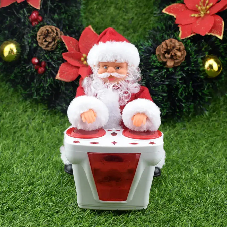 A festive santa claus figurine dressed in a red and white outfit, seated at a white and red dj-style turntable with illuminated panels.