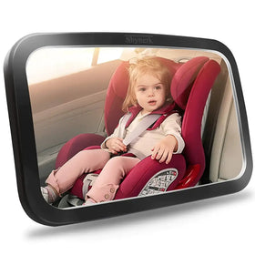 Black-framed rearview mirror displaying a child in a red car seat.