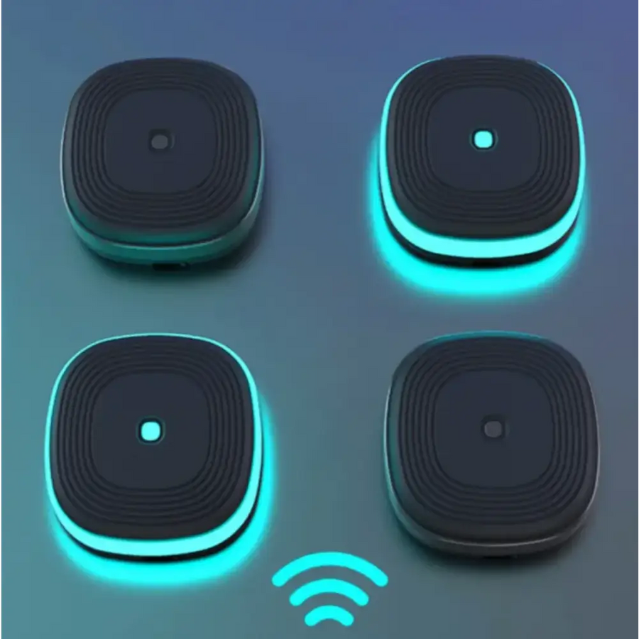 Black square-shaped wireless charging pads with glowing teal led rings and concentric circular patterns on the surface.