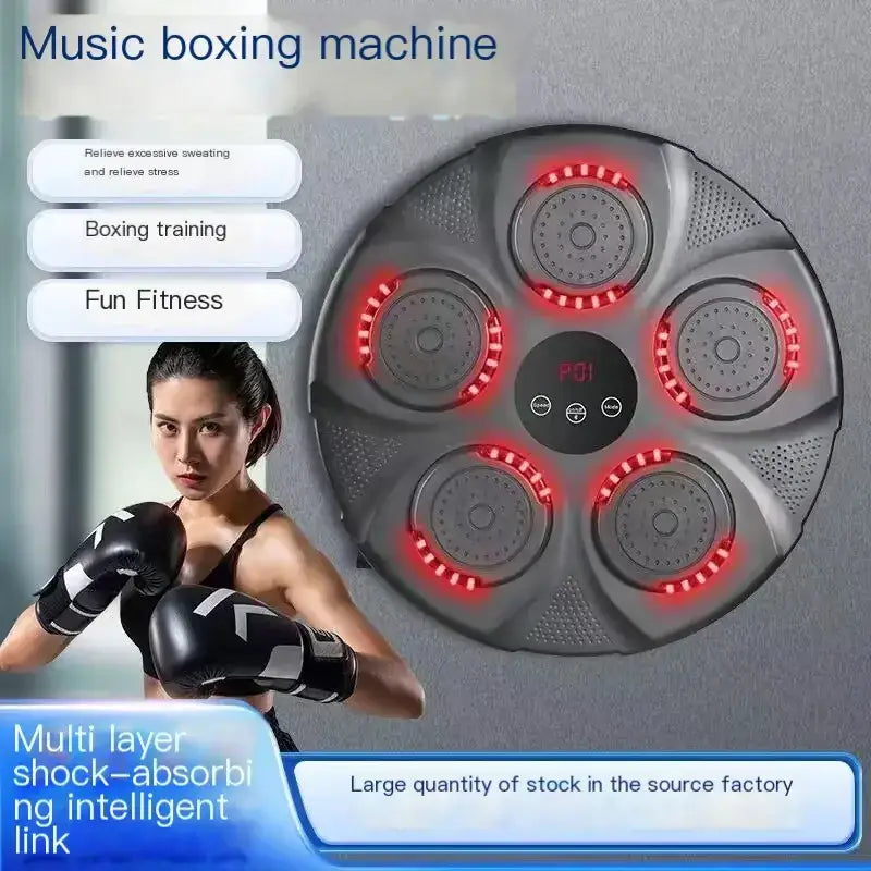 Gray circular music boxing machine with red led lights around five central chambers and a digital display.