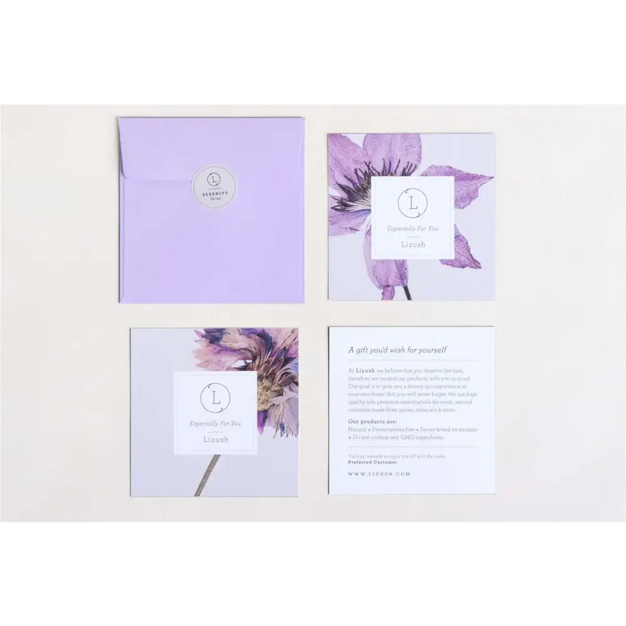 Lilac-colored envelope with a circular silver logo sticker.