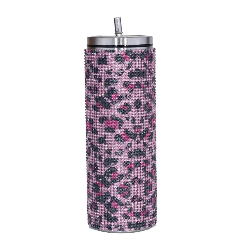 Pink and black leopard-print rhinestone-encrusted stainless steel tumbler with a silver lid and straw.