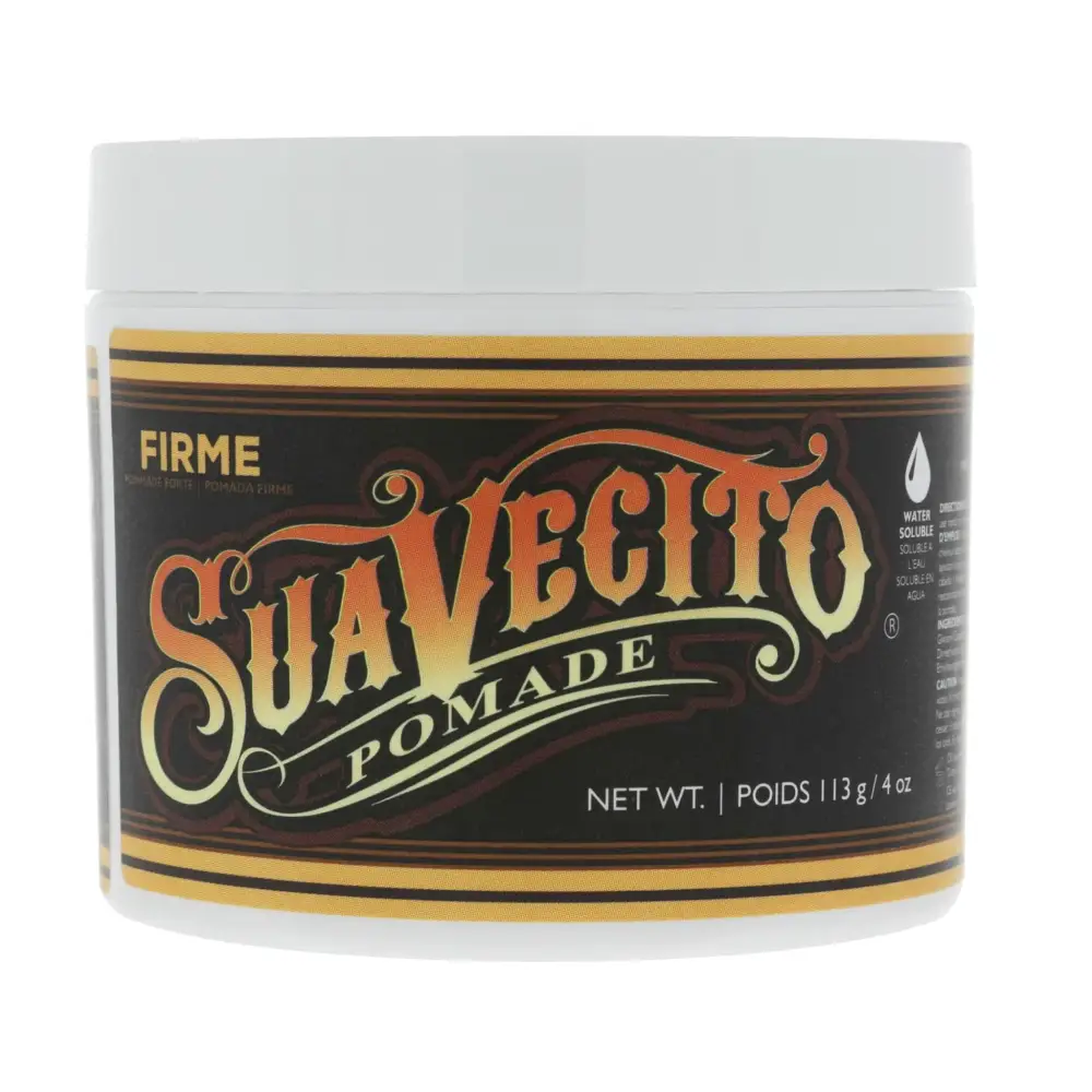 A white jar of suavecito firmé pomade with a black and gold label featuring ornate lettering.