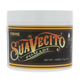 A white jar of suavecito firmé pomade with a black and gold label featuring ornate lettering.