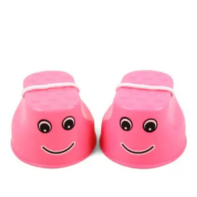 Pink plastic children’s step stools with cartoon faces and white rope handles.