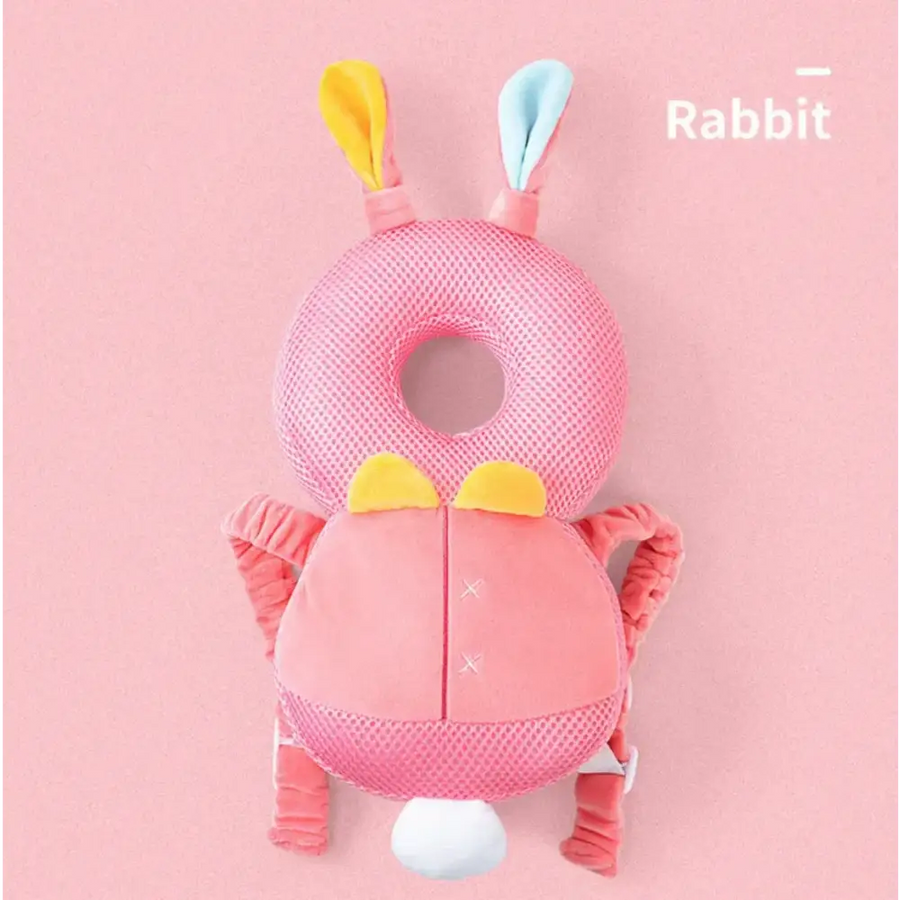 Pink mesh rabbit-shaped baby safety guard with yellow and light blue ears, a white tail, and soft fabric arms.