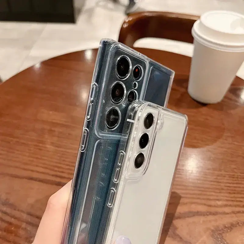 Transparent protective case for a samsung galaxy s21 ultra, featuring precise cutouts for the camera module and side buttons.
