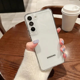 Clear protective case with a transparent border and white back panel, snugly fitted over a samsung smartphone.