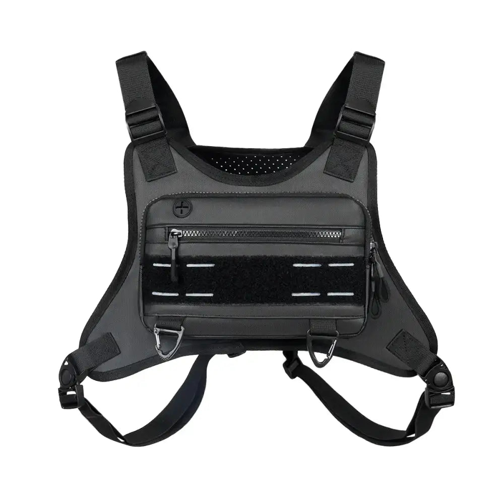 Black tactical chest rig with adjustable straps, zippered compartments, and a mesh panel for ventilation.