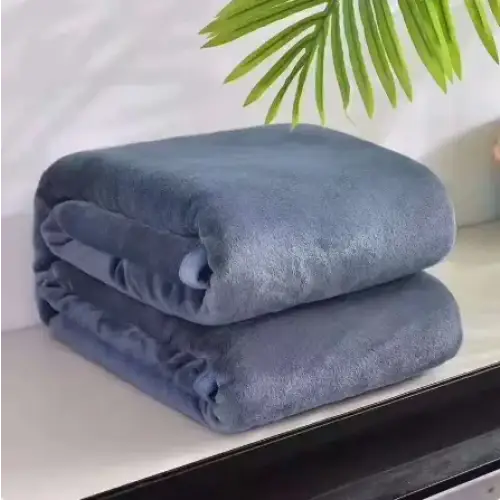 Stacked neatly, two plush navy blue fleece blankets with a soft, textured surface.