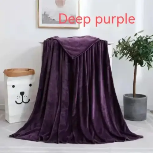 Deep purple plush blanket with a soft, velvety texture.
