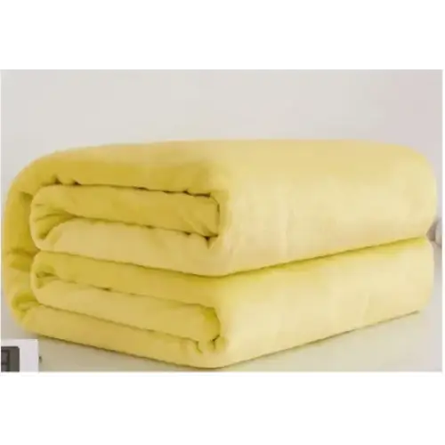 A soft, pale yellow fleece blanket with a plush texture and neatly folded edges.