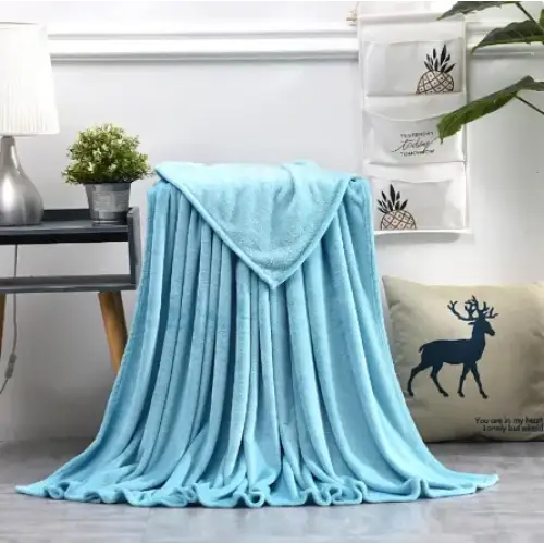 Light blue plush throw blanket with a soft, textured surface.