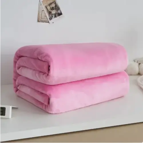 A soft, plush pink blanket neatly folded into two layers.