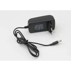 Black plastic ac adapter with a coiled black power cord and european-style plug.