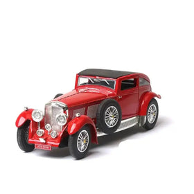 Red vintage-style diecast model car with a black convertible top and chrome detailing.