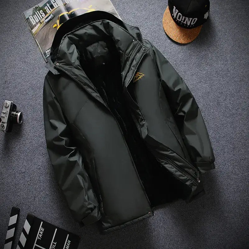 Dark green, water-resistant three-in-one outdoor jacket with a hood and subtle gold logo on the chest.