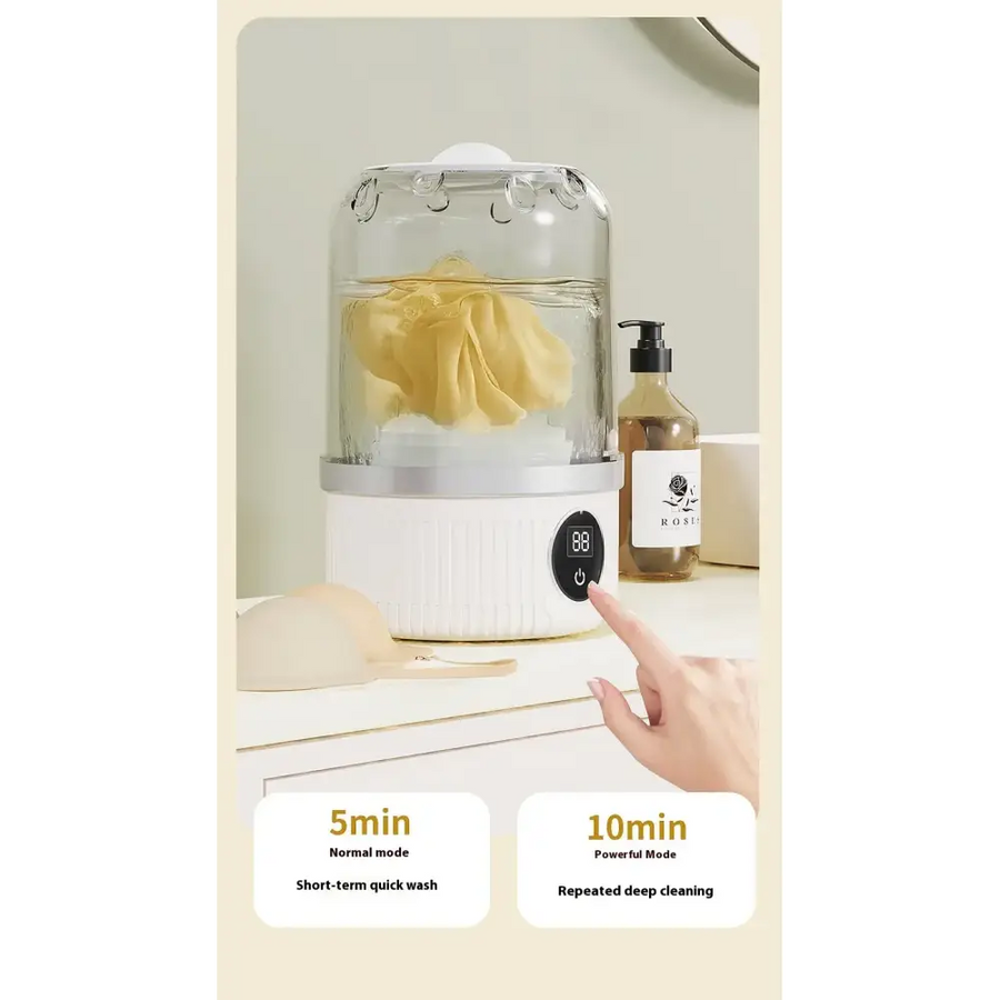 White electric garment steamer with a clear glass dome and silver accents, featuring a digital control panel for 5-minute normal mode or 10-minute powerful deep cleaning.