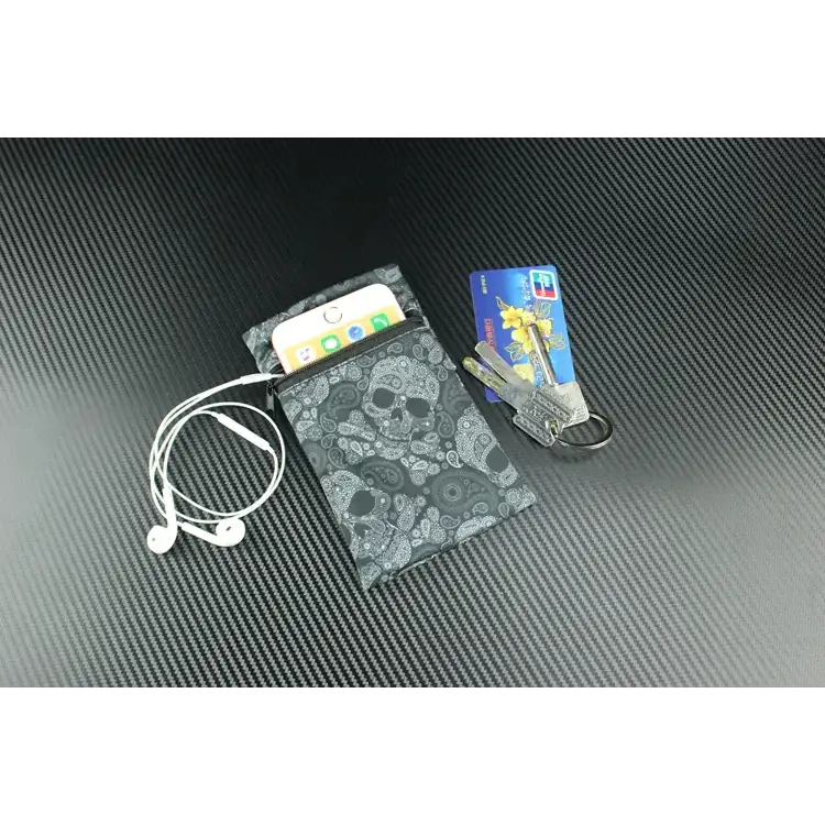 Black skull-patterned wallet with gray paisley design, made of fabric material.
