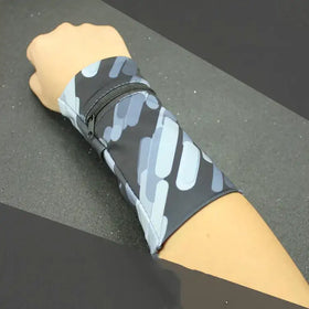 Gray and light blue camouflage-patterned wristband with a black zipper.