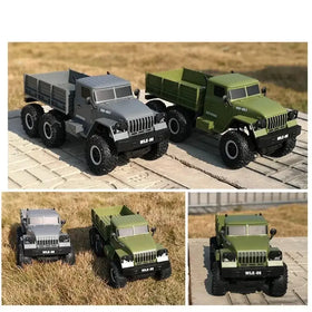 Gray and olive green remote-controlled six-wheel-drive military trucks with detailed chrome accents.