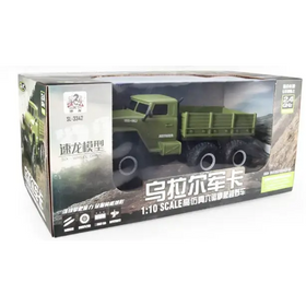 Green 1:10 scale remote-controlled military truck model in a box.