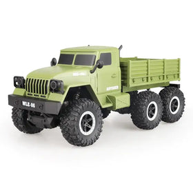 Olive green six-wheel remote control off-road truck with black tires and white rims.