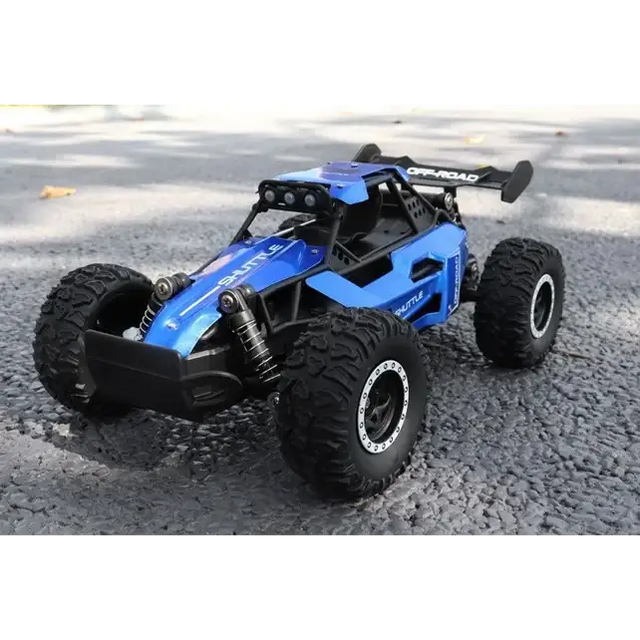 Blue and black remote-controlled off-road buggy with rugged tires, a visible suspension system, and ’off-road’ branding on the rear spoiler.