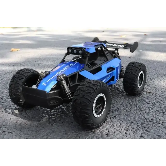 Blue and black remote-controlled off-road buggy with rugged tires, a visible suspension system, and ’off-road’ branding on the rear spoiler.