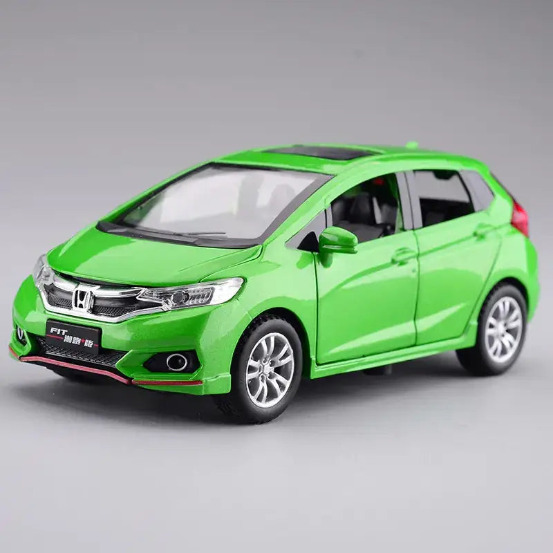 Vibrant green metallic honda fit die-cast model car with silver alloy wheels and black trim details.