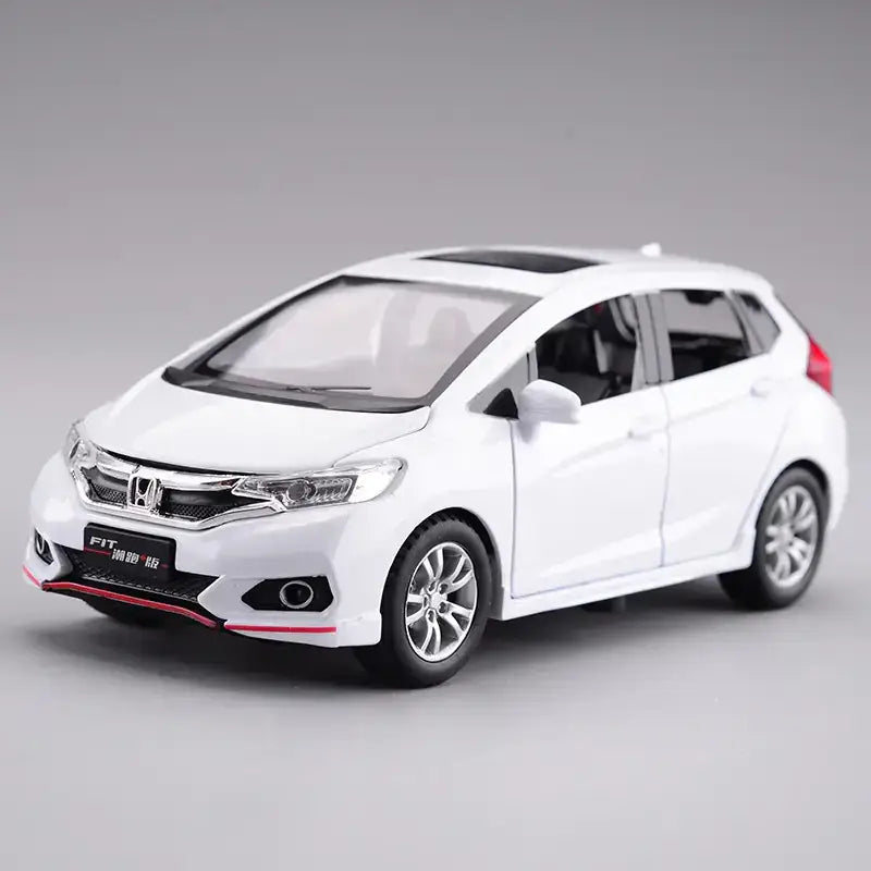 White honda fit diecast model car with red and black accent trim.