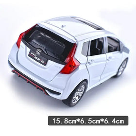 White die-cast honda fit model car with red taillights and black trim.