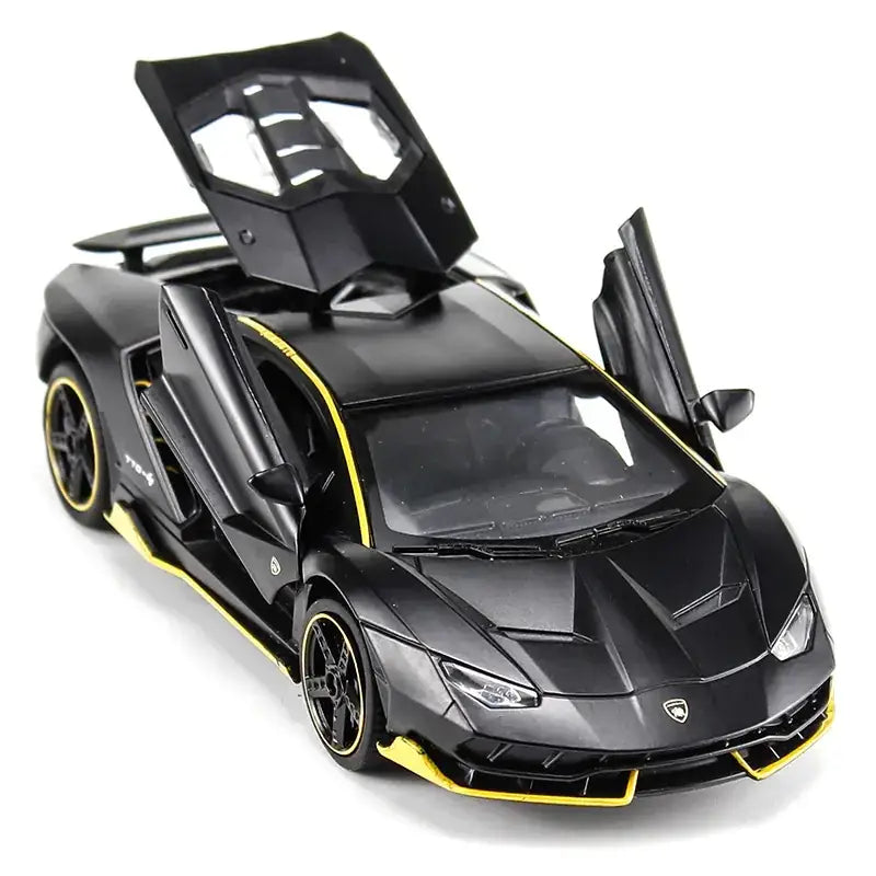 Black and yellow lamborghini model car with scissor doors open.