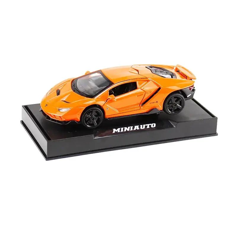 Vibrant orange die-cast lamborghini centenario model car with black wheels and detailed interior, displayed on a branded miniauto base.