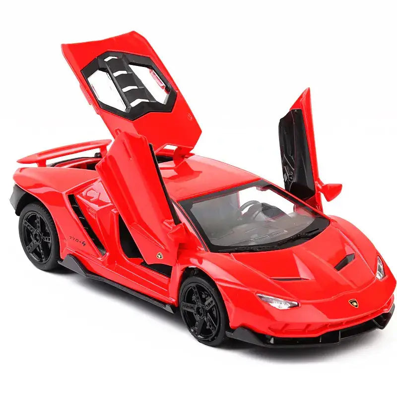 Red die-cast lamborghini centenario model car with scissor doors open, black wheels and interior details.