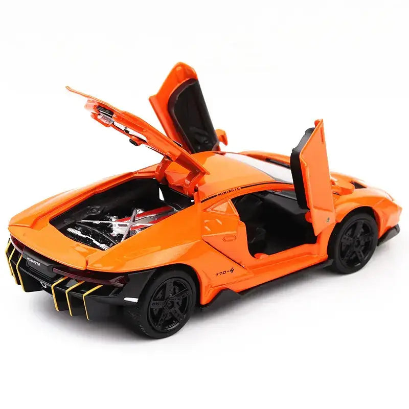 Vibrant orange die-cast lamborghini centenario model car with black interior and gold-accented rear diffuser.